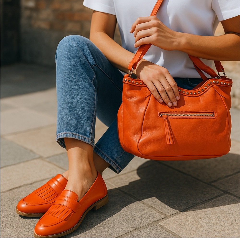 Janie and Jack orange loafers with fringe style design on top. Ntn!